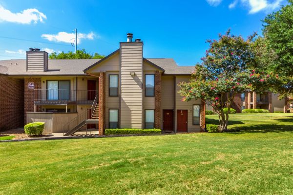 Valley Creek Apartments building exterior with well-maintained grounds and landscaping