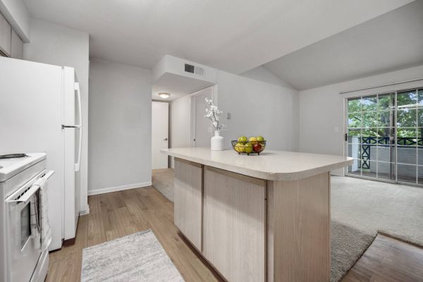 La Calera apartment interior with open kitchen and island inside light-flooded cooking area with modern fixtures