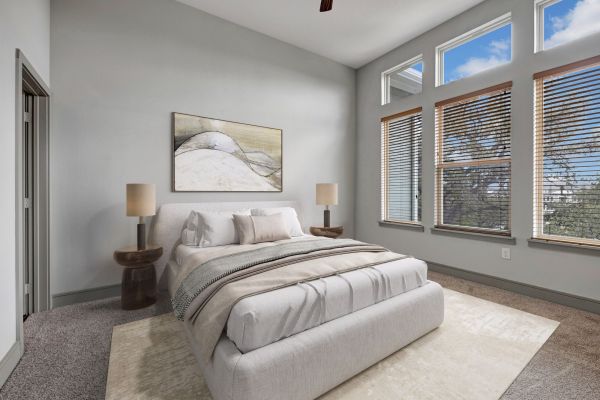 Enclave at the Dominion apartment bedroom with huge windows and grand bedroom furniture