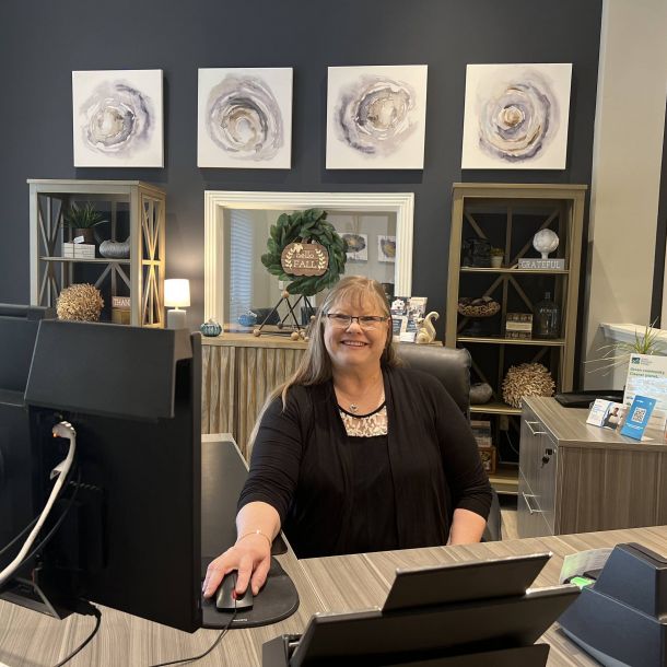 Irwin R Rose employee sits at a desk in front of her computer in her office