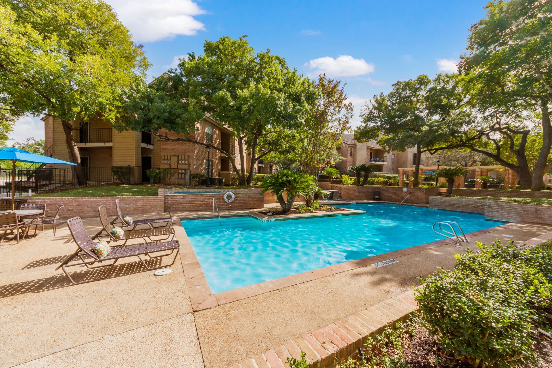 Altamonte Apartments property exterior with large community pool
