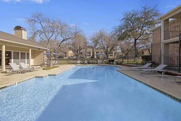 Village Green Apartments community pool and outdoor lounge