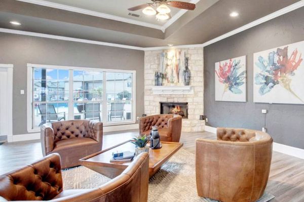 Riviera apartments community center with indoor lounge and fireplace